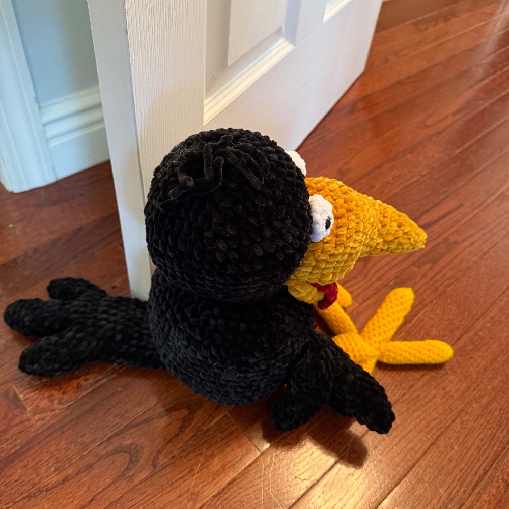 Velvet soft squished crocheted black bird door stop